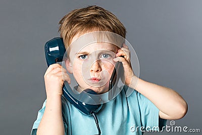 Unhappy kid listening to two voices for burnout communication concept Stock Photo