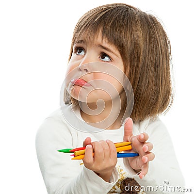 Unhappy little girl with crayons. Stock Photo