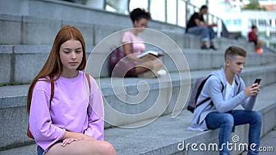 Unhappy teen female suffering from loneliness, lack of friends, unrequited love Stock Photo