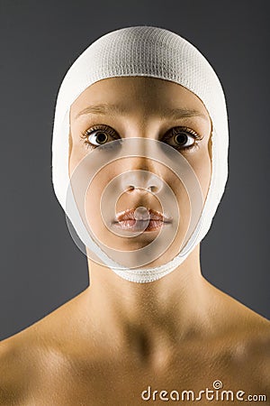 Unhappy woman with bandage Stock Photo