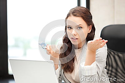 Unhappy woman with computer and euro cash money Stock Photo