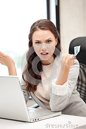Unhappy woman with computer and euro cash money Stock Photo