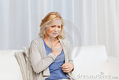 Unhappy woman suffering from heartache at home Stock Photo