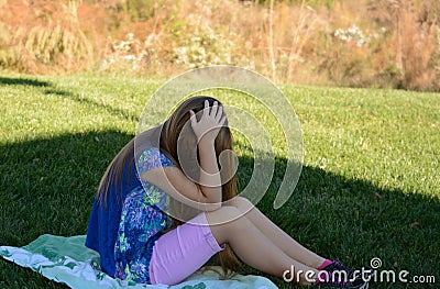 Unhappy young girl. Stock Photo