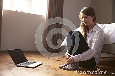 Unhappy Young Woman Being Bullied Online With Laptop Stock Photo