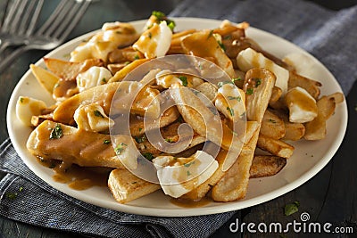 Unhealthy Delicious Poutine with French Fries Stock Photo