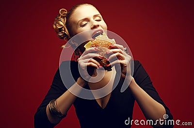 Unhealthy eating. Junk food concept. Guilty pleasure. Woman eating burger Stock Photo