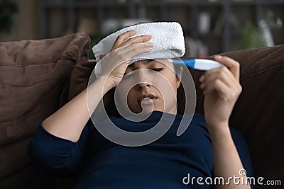 Unhealthy Indian female suffer from influenza at home Stock Photo
