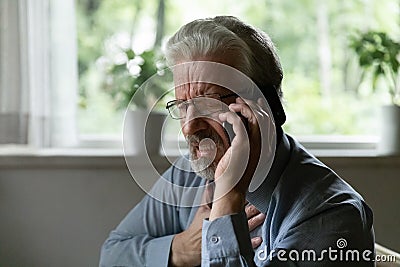 Unhealthy old man call ambulance feeling sick Stock Photo