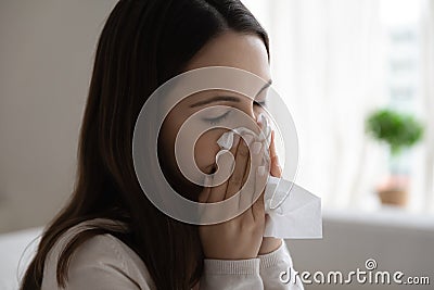 Unhealthy woman blow nose suffer from cold Stock Photo