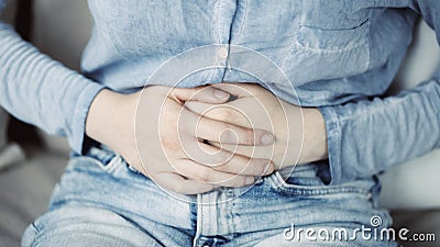 Unhealthy young woman with stomachache Stock Photo