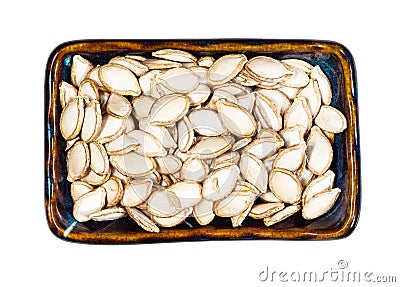 Unhusked Pumpkin seeds in rectangular bowl cutout Stock Photo