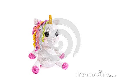 Unicorn crochet plush doll isolated on white background. Stock Photo