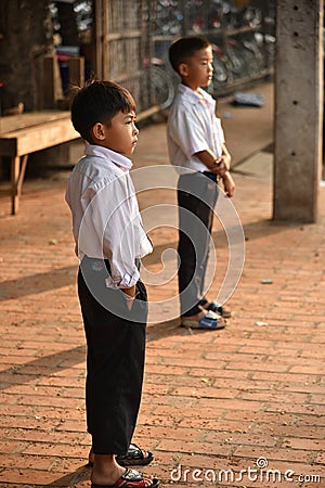 Unidentified boys waiting to go to school Editorial Stock Photo