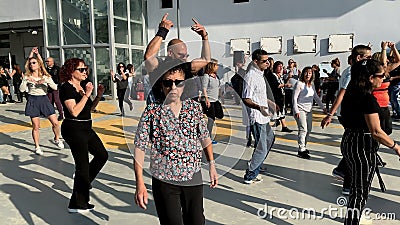 Unidentified citizens dancing traditional Israeli dances on Tel Aviv Promenade Editorial Stock Photo