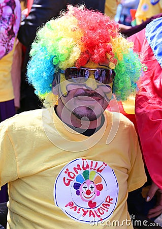 Unidentified Clown with colorful wig posing at Orange Blossom Carnival Editorial Stock Photo