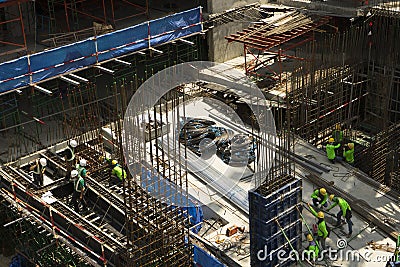 Unidentified construction workers working at high level of construction site in Bangkok,Thailand Editorial Stock Photo