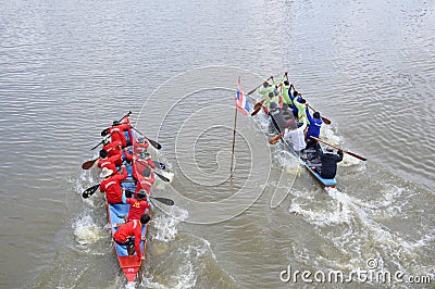 Unidentified crew in traditional Thai long boats compete during Country cup. Traditional Long Editorial Stock Photo