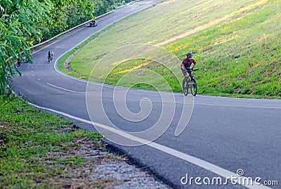 Unidentified cyclist cycling uphill Editorial Stock Photo