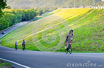 Unidentified cyclist cycling uphill Editorial Stock Photo