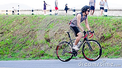 Unidentified cyclist cycling uphill Editorial Stock Photo