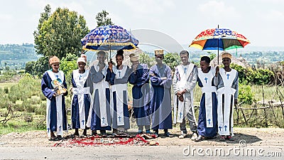 Unidentified Ethiopian tennagers collecting donation for religion on road sideway Editorial Stock Photo