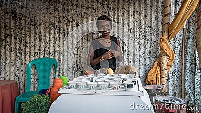 Unidentified Ethiopian woman making traditional coffee in a hut Editorial Stock Photo