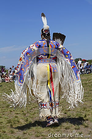 Unidentified female Native American dancer wears traditional Pow Wow dress during the NYC Pow Wow Editorial Stock Photo