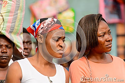 Unidentified Ghanaian women attentively look at something. Editorial Stock Photo