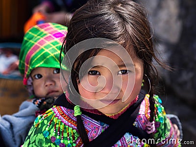 Unidentified Hmong Girl Carrying Baby in Sapa, Lao Cai, Vietnam Editorial Stock Photo