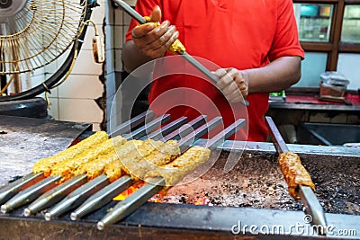 Unidentified Man grilling an Indian Chicken and Mutton Kebabs at Chandni Chowk Stock Photo