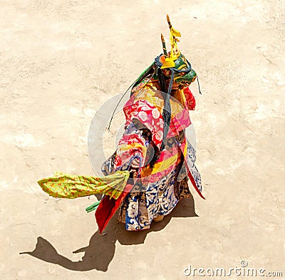 Monk in a bull deity mask performs a religious masked and costumed mystery dance of Tantric Tibetan Buddhism on the Cham Dance Stock Photo