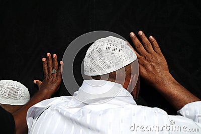 Unidentified Muslim pilgrims near the Kaabah Editorial Stock Photo