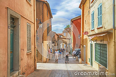 Unidentified poople walking in street, Architecture of Saint Tropez city in French Riviera, France Editorial Stock Photo