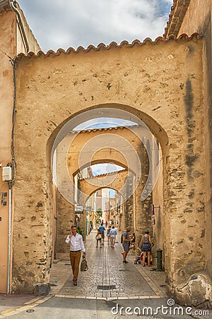 Unidentified poople walking in street, Architecture of Saint Tropez city in French Riviera, France Editorial Stock Photo