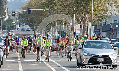 Unidentified protestor in cars and bicycle caravan promoting prop 15 Editorial Stock Photo