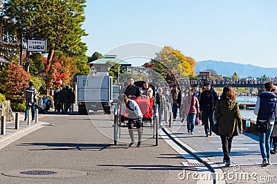 Unidentified tourists enjoy walking along Hozu gawa river at Arashiyama Editorial Stock Photo