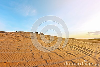 Unidentified tourists on white sand dunes Editorial Stock Photo