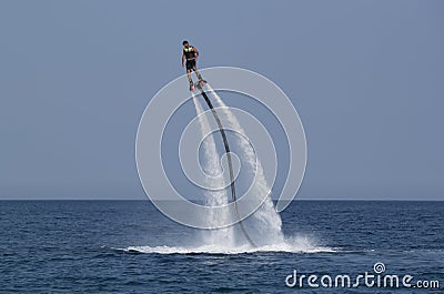 Unidentified Turkish man hovered above the water Editorial Stock Photo