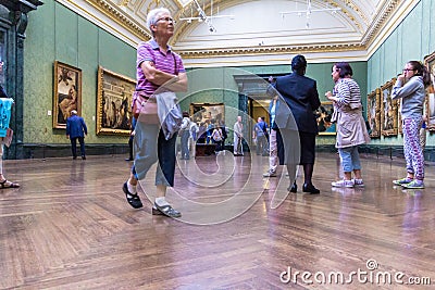 Unidentified visitors in one of the halls of the London National Gallery Editorial Stock Photo