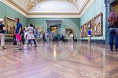 Unidentified visitors in one of the halls of the London National Gallery Editorial Stock Photo