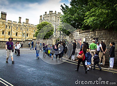 Unidentified visitors queuing in front of the Windsor Castle. UK Editorial Stock Photo