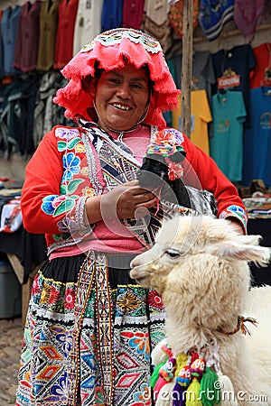 Unidentified Woman with Alpaca at the Market of Pisac in Peru Editorial Stock Photo