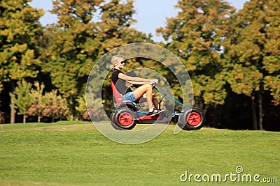 Unidentified woman in a buggy in the park in Mezhyhirya, Ukraine Editorial Stock Photo