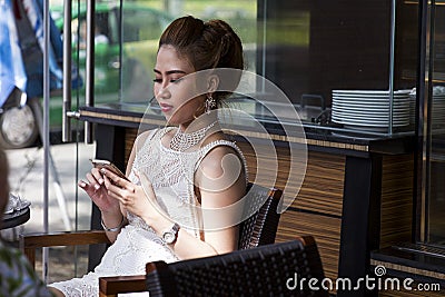 Vietnamese woman with mobile phone Editorial Stock Photo