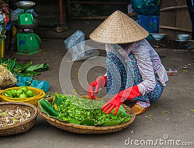 Unidentified woman seller in the old quarter of Saigon Editorial Stock Photo