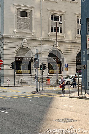 Unidentified woman waiting traffic light Editorial Stock Photo