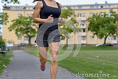 Unidentified woman wearing tank top and shorts Stock Photo