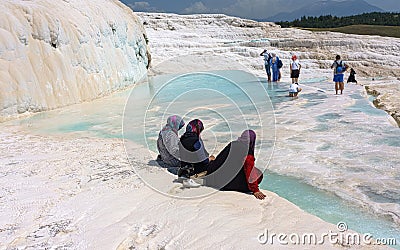 Unidentified women watch Pamukkale known with its travertine terraces and health-giving pools with mineral water. Turkey. Editorial Stock Photo