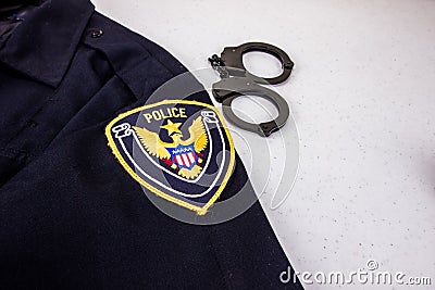 Uniform With Handcuffs And Generic Police Patch Stock Photo